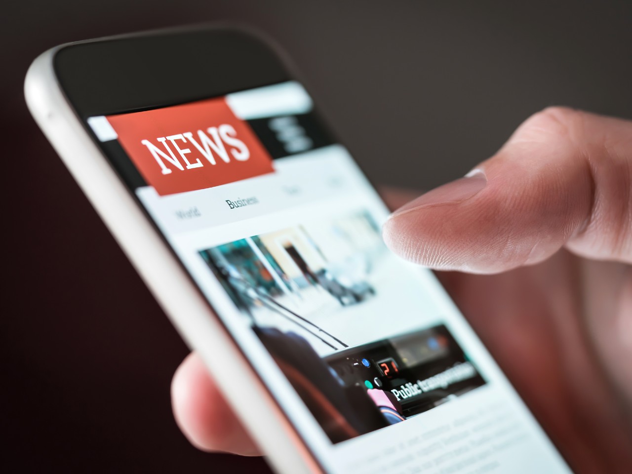 A user viewing new updates on a mobile device: IT News Round-up Dec 2021